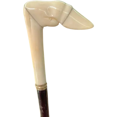 A walking stick with a side handle made of ivory in the shape of a deer's hoof.