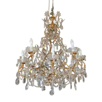Twelve-light chandelier made of gold metal and crystal, with drops