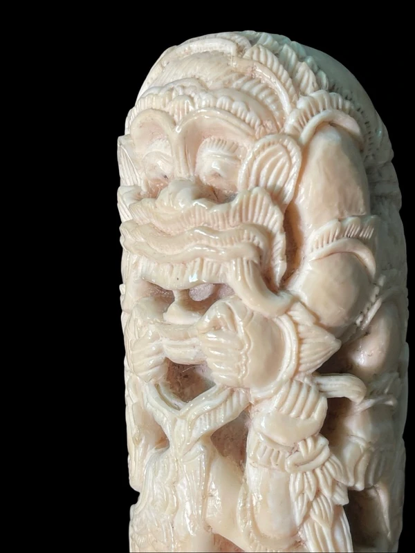 Cane with an ivory knob carved with figures and plant motifs; bamboo shaft.