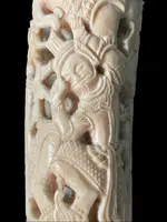 Cane with an ivory knob carved with figures and plant motifs; bamboo shaft.