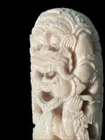 Cane with an ivory knob carved with figures and plant motifs; bamboo shaft.