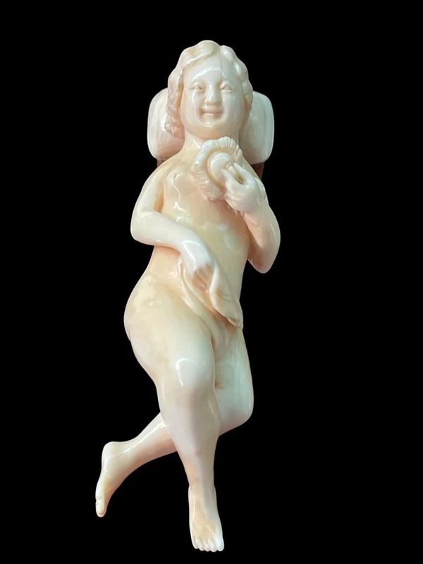 A walking stick with an ivory handle featuring an erotic motif of a reclining female figure.