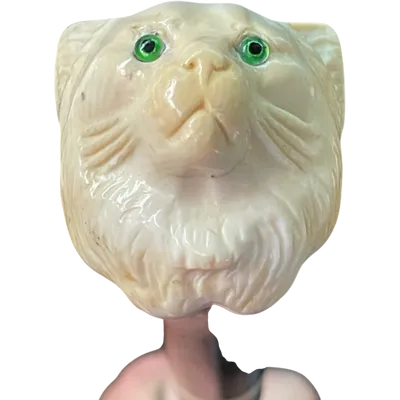 Walking stick with an ivory knob shaped like a cat's head. Rosewood shaft.