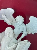 Bas-relief sur une plaque d'ivoire représentant un ange avec Moïse (?).