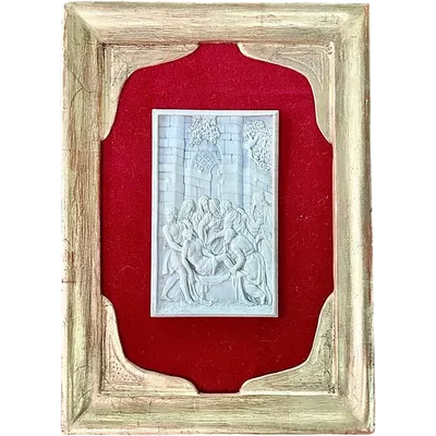 A low-relief ivory sculpture on a thin sheet of metal depicting the Entombment of Christ.
