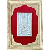 A low-relief ivory sculpture on a thin sheet of metal depicting the Entombment of Christ.