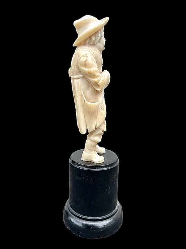Small ivory sculpture depicting a beggar. Netherlands.