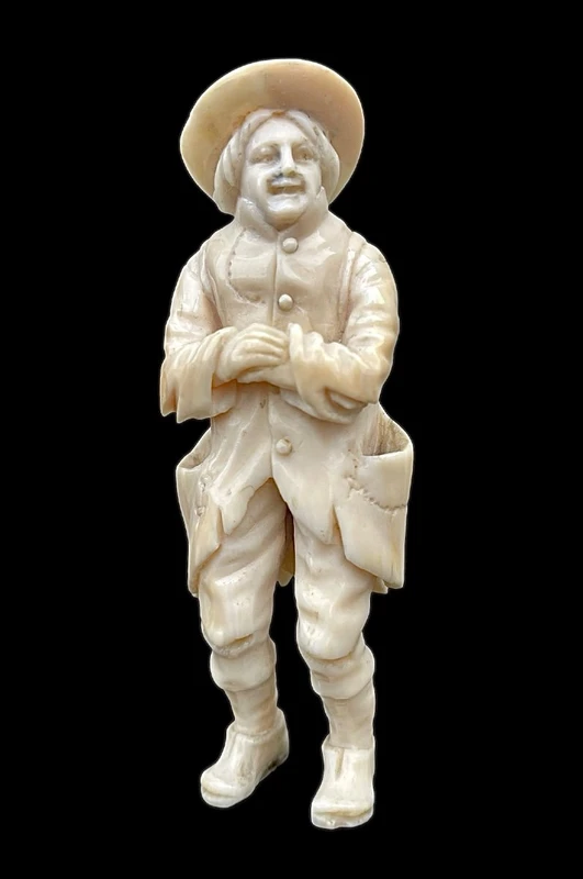 Small ivory sculpture depicting a beggar. Netherlands.