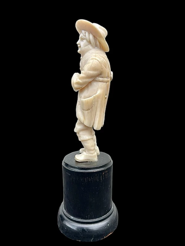 Small ivory sculpture depicting a beggar. Netherlands.