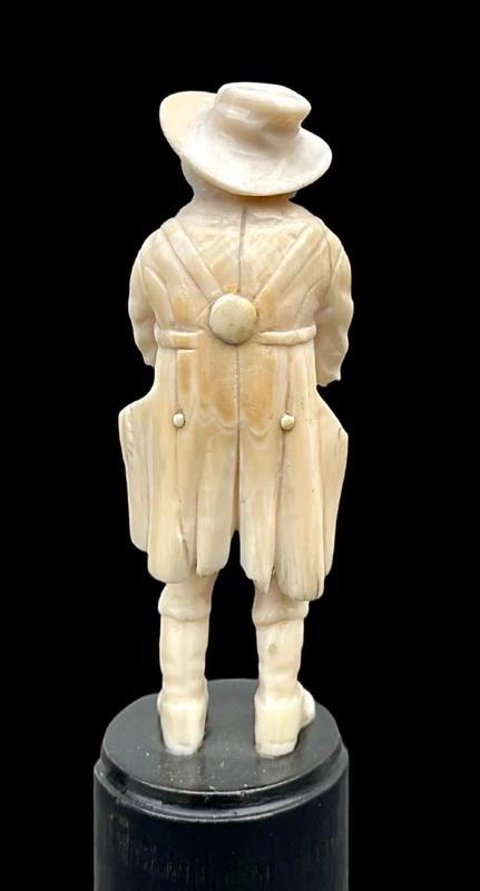 Small ivory sculpture depicting a beggar. Netherlands.