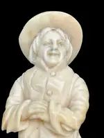 Small ivory sculpture depicting a beggar. Netherlands.
