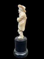 Small ivory sculpture depicting a beggar. Netherlands.