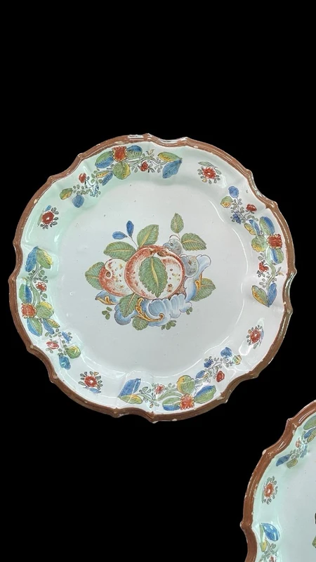 Three majolica plates with scalloped rims and high-fire “Baroque fruit” decoration.