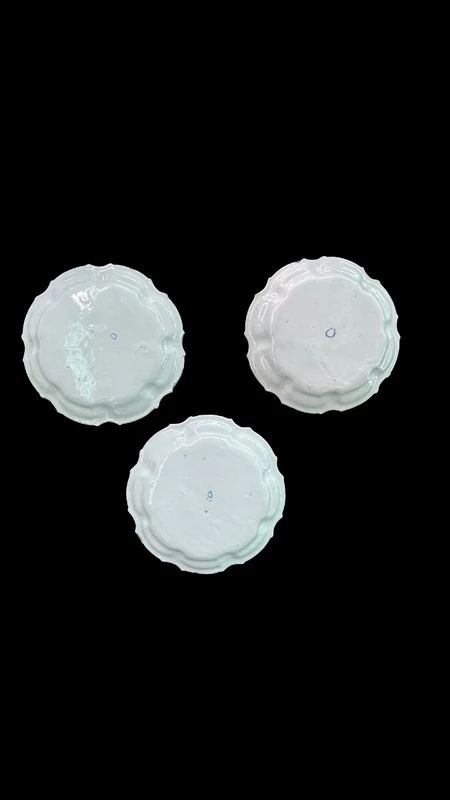 Three majolica plates with scalloped rims and high-fire “Baroque fruit” decoration.