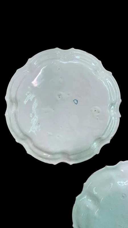 Three majolica plates with scalloped rims and high-fire “Baroque fruit” decoration.