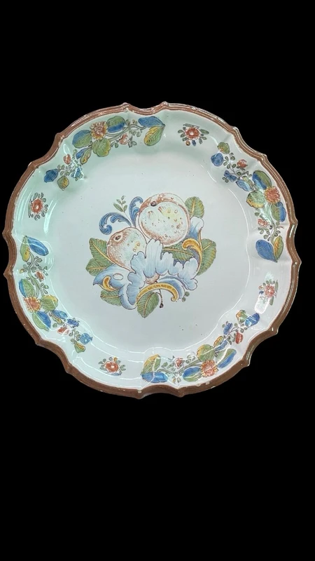 Three majolica plates with scalloped rims and high-fire “Baroque fruit” decoration.
