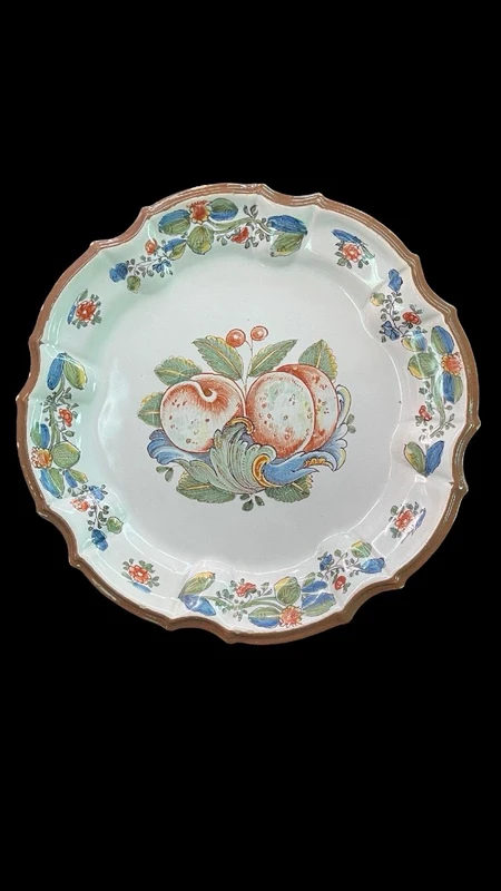 Three majolica plates with scalloped rims and high-fire “Baroque fruit” decoration.