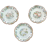 Three majolica plates with scalloped rims and high-fire “Baroque fruit” decoration.