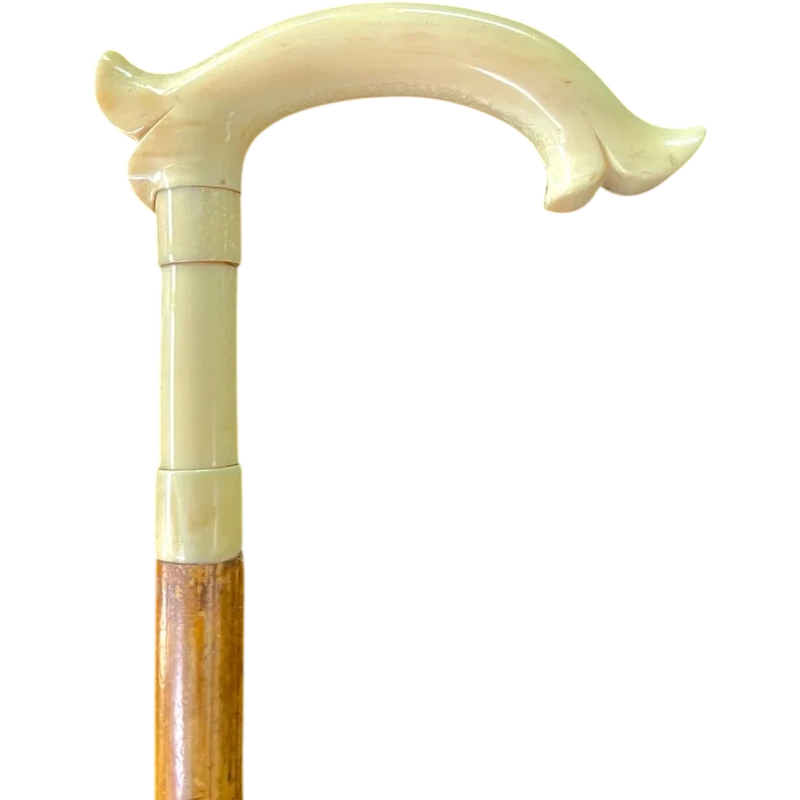 Cane with an ivory tau-shaped handle featuring a stylized rocaille motif.