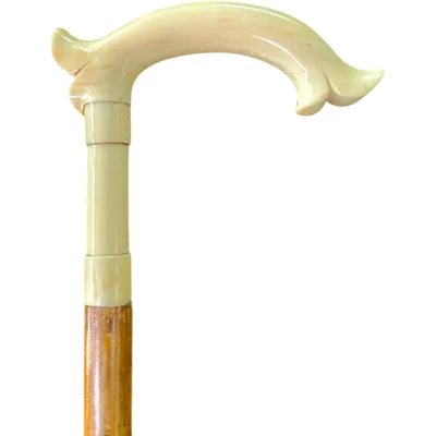 Cane with an ivory tau-shaped handle featuring a stylized rocaille motif.