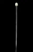 A walking stick with a round ivory knob engraved with Japanese figures.