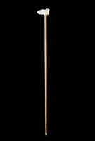A walking stick with an ivory side handle depicting a dog hunting a hare.