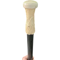 A walking stick with a spherical ivory pommel featuring a deer figure engraved in bas-relief.