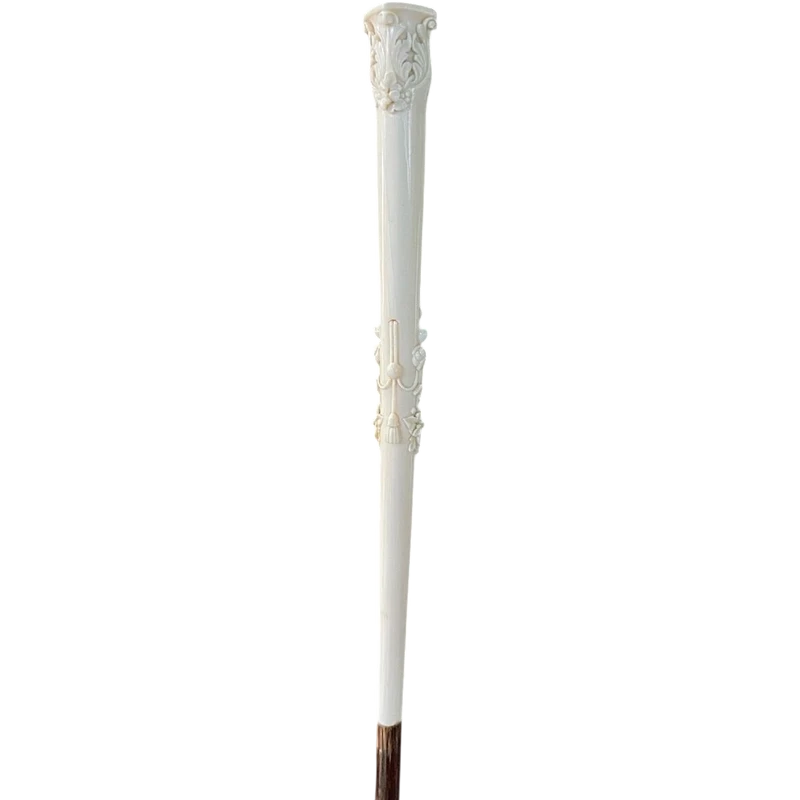 An evening cane with an ivory knob featuring a relief shield and rocaille motifs.