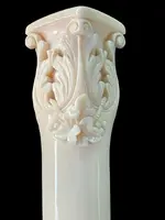 An evening cane with an ivory knob featuring a relief shield and rocaille motifs.