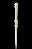 An evening cane with an ivory knob featuring a relief shield and rocaille motifs.