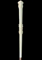 An evening cane with an ivory knob featuring a relief shield and rocaille motifs.