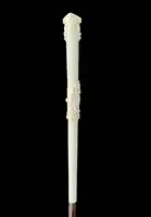 An evening cane with an ivory knob featuring a relief shield and rocaille motifs.