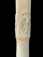 An evening cane with a square-section ivory knob featuring three monkeys engraved in bas-relief.