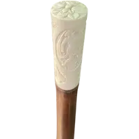 Cane with an ivory "plume" knob featuring cherubs engraved within three ovals