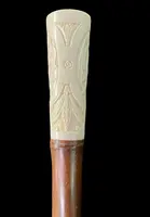 Cane with an ivory "plume" knob featuring cherubs engraved within three ovals