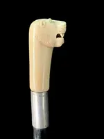 Cane with an ivory knob shaped like a lion's head.