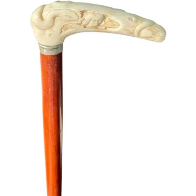A staff with a side handle in the shape of a tau, made of ivory and depicting a snake hunting inside a tree trunk.