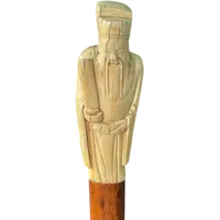 A walking stick with an ivory pommel depicting an Asian male figure.