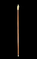 A walking stick with an ivory pommel depicting an Asian male figure.