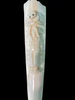 A walking stick with a "plume" knob featuring a high-relief figure of a child playing with a cat.
