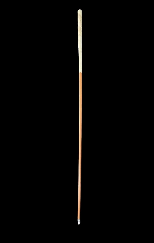 An evening cane with an ivory “plume” knob engraved with lions in bas-relief.