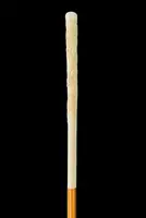 An evening cane with an ivory “plume” knob engraved with lions in bas-relief.