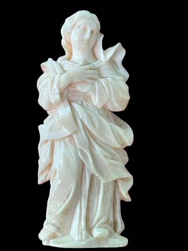 A bas-relief sculpture in ivory depicting a saint.