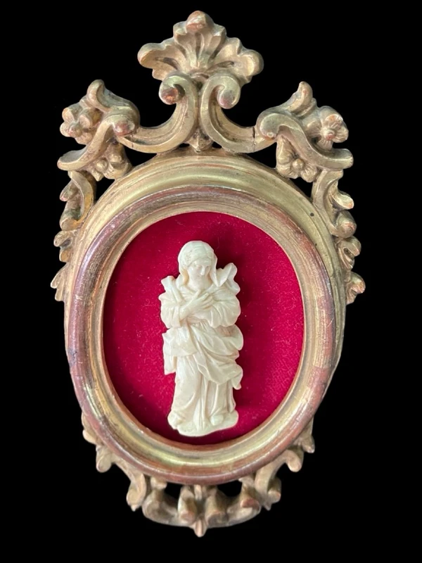 A bas-relief sculpture in ivory depicting a saint.