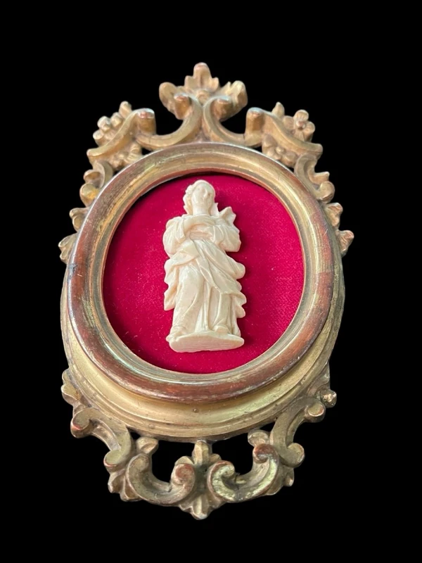 A bas-relief sculpture in ivory depicting a saint.