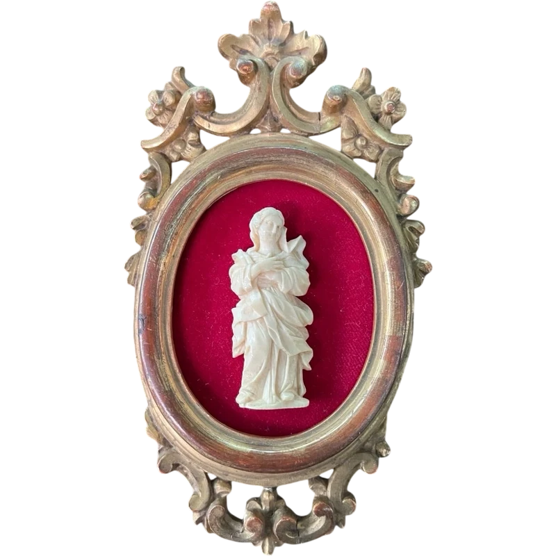 A bas-relief sculpture in ivory depicting a saint.