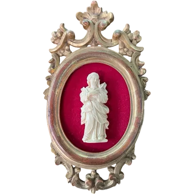 A bas-relief sculpture in ivory depicting a saint.