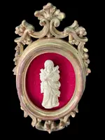 A bas-relief sculpture in ivory depicting a saint.