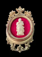 A bas-relief sculpture in ivory depicting a saint.