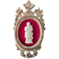A bas-relief sculpture in ivory depicting a saint.